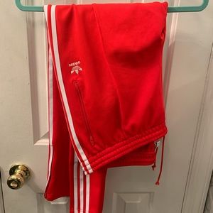 Classic Adidas red track pants.